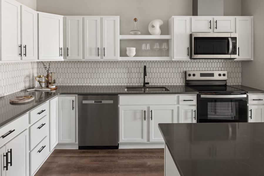 The Meridian apartments spacious kitchen with island countertops with bar seating and ample cabinet space