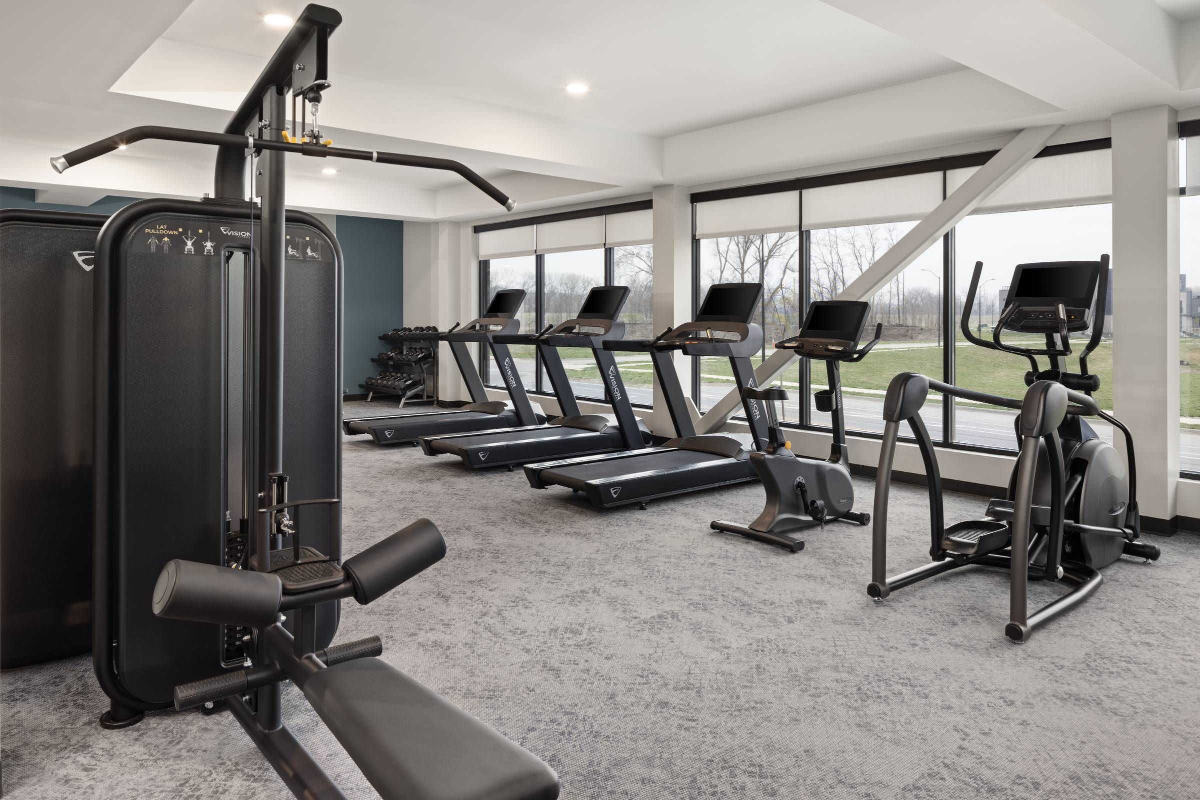 The Meridian apartments fitness studio with cardio and strength training equipment.