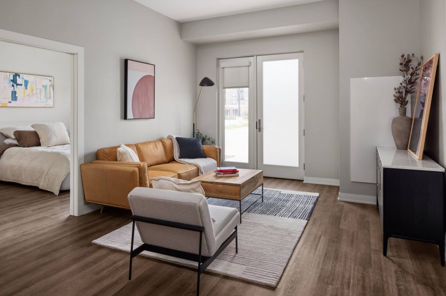 The Meridian apartments model living room with spacious seating space