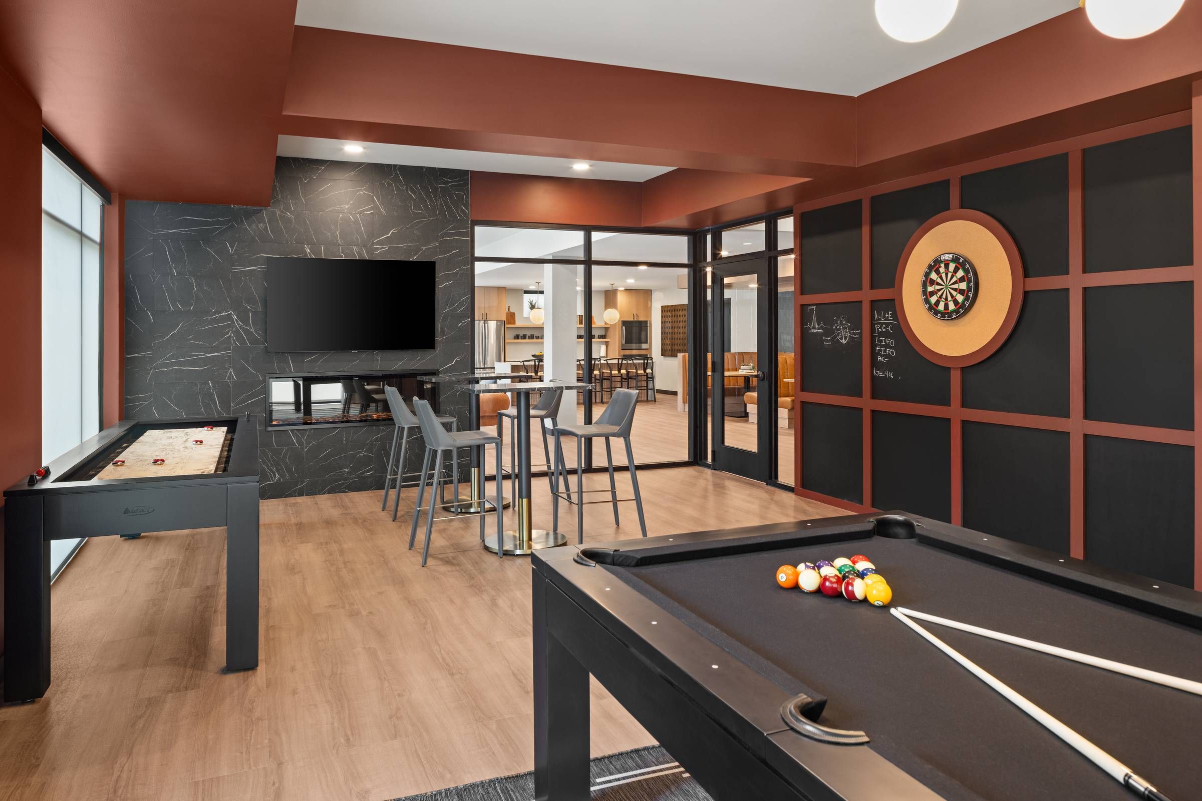 The Meridian apartments game room with dart board and pool table