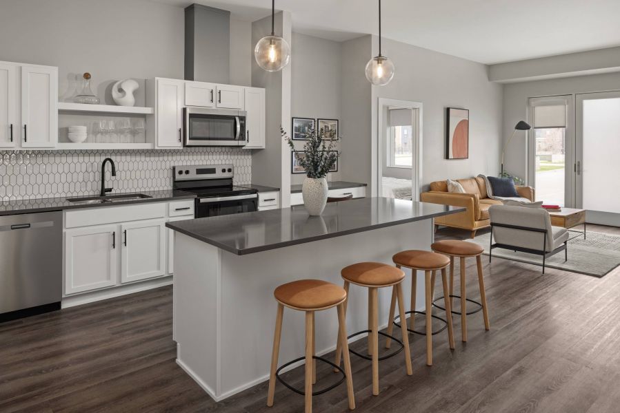 The Meridian apartments spacious kitchen with island countertops with bar seating and ample cabinet space