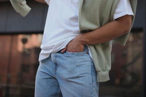 young man posing with a hoodie outside of the meridian